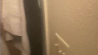 Blasian bent over baths sink whilst roommates in other room - 2 image