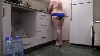 big beautiful woman mother I'd like to fuck housewife in the kitchen wearing merely pants. - 3 image