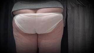 In a fitting room in a public store, the camera caught a corpulent mother i'd like to fuck with a pretty butt in transparent pants. PAWG. - 3 image