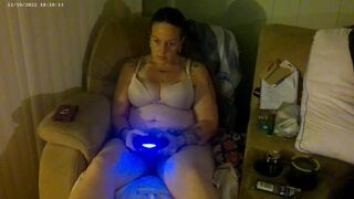 Breasty Lengthy Hair Brunette Hair In Brassiere and Pants Playing PlayStation - 2 image