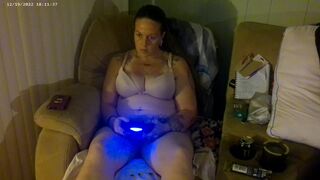 Breasty Lengthy Hair Brunette Hair In Brassiere and Pants Playing PlayStation - 3 image