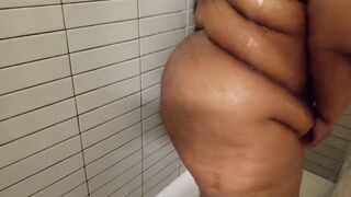 sexy darksome large gorgeous woman takes a shower - 5 image