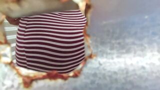 Caught through a hole in the dressing room in public