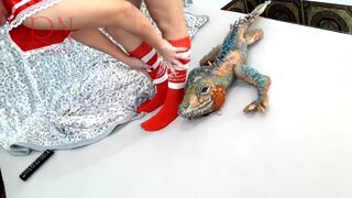 Girl with sexy school uniform is dancing without panties. Striptease with big iguana toy. c3
