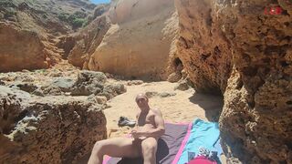 Blowjob with cumshot on a crowded beach... - 1 image