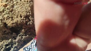 Blowjob with cumshot on a crowded beach...